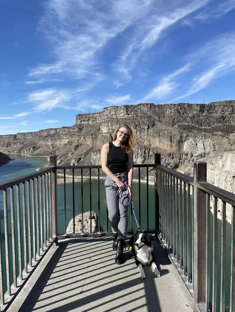 Brenyn and her dog at a lake