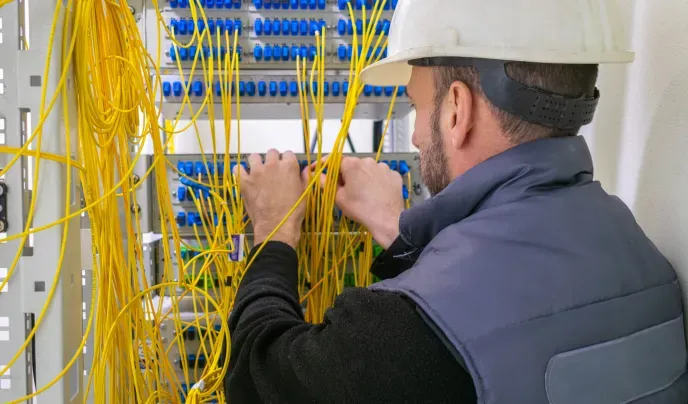 Man connecting cables