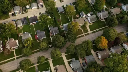 birds-eye view of rooftops in a neighborhood. 