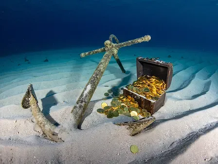Image showing an anchor and treasure chest on the ocean floor.