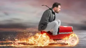A guy speeding in a toy car
