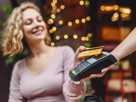 Woman paying with a debit card