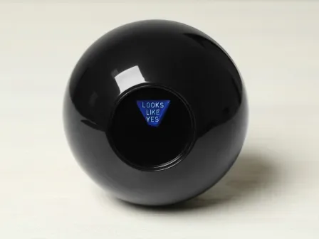 Magic 8 ball displaying answer "Looks like yes"