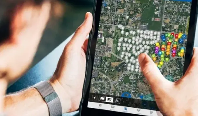 Person using sales mapping by SalesRabbit on a tablet