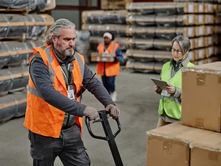 Man pulling a pallet at a warehouse